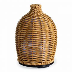 The Wicker Vase Medium Diffuser has a matte wicker that is tightly woven into a beautiful sleeve, giving off a subtle glow when in use. This diffuser brings a natural warmth to your space with organic, earthy textures and neutral tones.