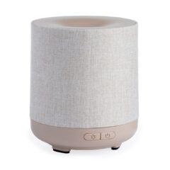 DESIGN: With its effortless neutral design, the Natural Linen Ultrasonic Diffuser makes an elegant addition to any contemporary home. Enjoy the aromatic advantages of essential oils with a diffuser that perfectly matches your minimalist style and decor. Wrapped in real, high quality linen, this diffuser provides a luxury look and feel that compliments any surrounding decor.
USE: 120 mL capacity allows for 4-8 hours of runtime. It has 2 mist modes, continuous or intermittent. Diffuses through a side, directional slot so you can point it towards your face or any direction you want the mist directed.
INCLUDES: BPA-Free Plastic sleeve, Plastic base, 5 ft cord, Water vessel. Overall Dims: 4.4