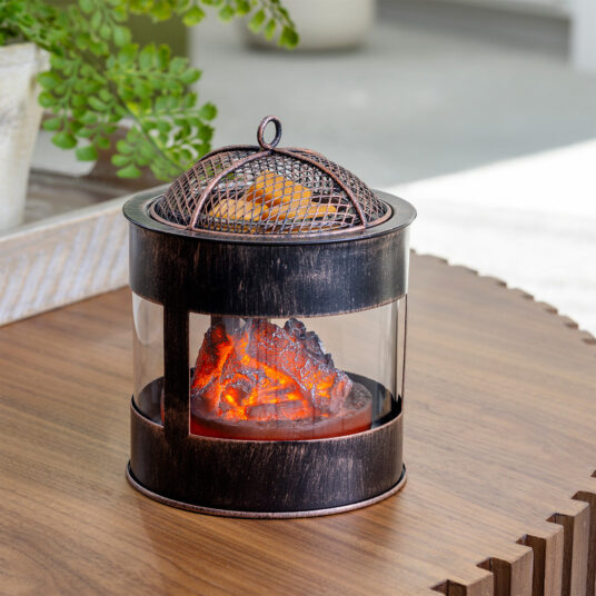 The Fire Pit Wax Warmer brings the cozy ambiance of a crackling fire into your home. The design mimics a rustic fire pit, featuring a mesh lid and the comforting glow of smoldering embers. Enjoy the essence of the outdoors year-round while filling your space with your favorite scents.