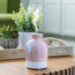 Brighten your decor with the playful, iridescent pink Bubble Vase USB diffuser. Enjoy hours of whisper-quiet mist from this stylish 100ml ultrasonic diffuser- a charming accent that fills small spaces with gentle fragrance.